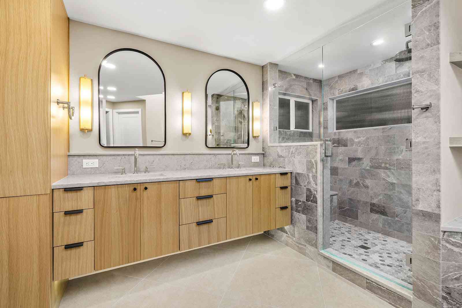 Modern bathroom with double vanity sinks, large mirrors in Greater Bellevue